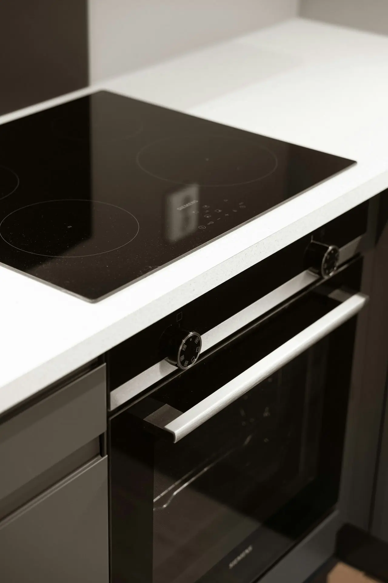 A black and white photo of a stove top oven